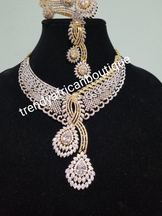 Back in stock- Special price: New arrival Celebrants 4pcs matching set of 22k Gold Electroplated with CZ silver  stones setting. Quality piece of accessories, hypoallergenic. Necklace, earrings, ring and bangle set.