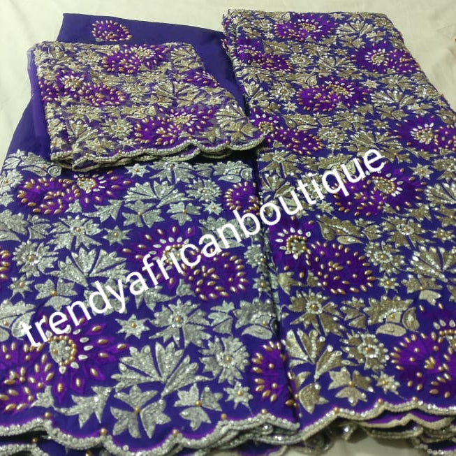 VIP Embriodery Silk George wrapper and matching net blouse. Purple George, All over beaded and Crystal stones hand made to perfection. Quality Guaranteed. 2 wrapper of 2.5yds each and 1.8yds blouse. Nigerian madam George's. 3 colors available