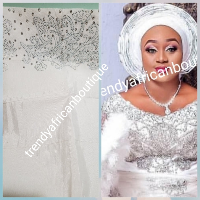 Combo sale: White crystal Net George wrapper 2.5yds  Net+ 2.5yds taffeta silk+ 1.8yd net for blouse+ white aso-oke gele all embellished with dazzling silver crystal stones. Nigerian Bridal George for that special occasion. Quality