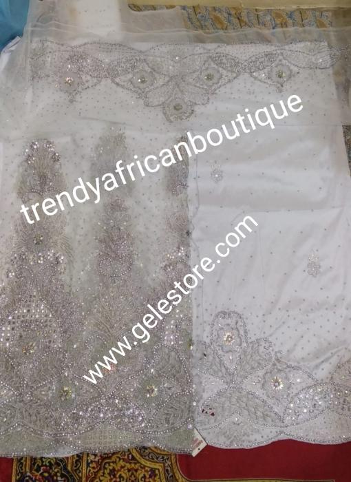 Combo sale: White crystal Net George wrapper 2.5yds  Net+ 2.5yds taffeta silk+ 1.8yd net for blouse+ white aso-oke gele all embellished with dazzling silver crystal stones. Nigerian Bridal George for that special occasion. Quality