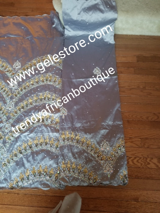 Ready to ship:  Exclusive design ash/Gray Color VIP hand beaded and stoned Nigerian traditional Celebrant in quality taffeta Silk George wrapper with matching blouse. Niger/Delta/Igbo women Georges. Sold as set of 2 wrapper +1.8yds blouse.