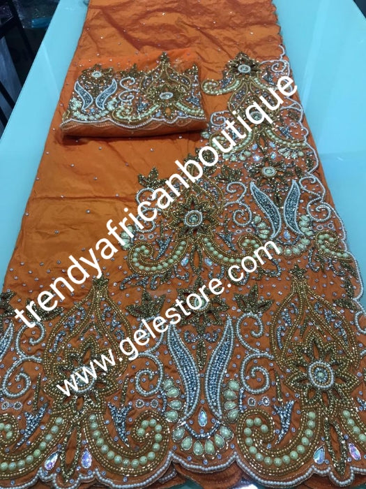 Sweet Orange VIP Hand  beaded and crystal Stoned Silk George wrapper, champagne net for blouse.  Nigerian, Igbo/Delta traditional wedding out fit. Sold as full 2.5yds with side border design + 2.5yds + 1.8yds matching net for blouse. Quality taffeta silk!