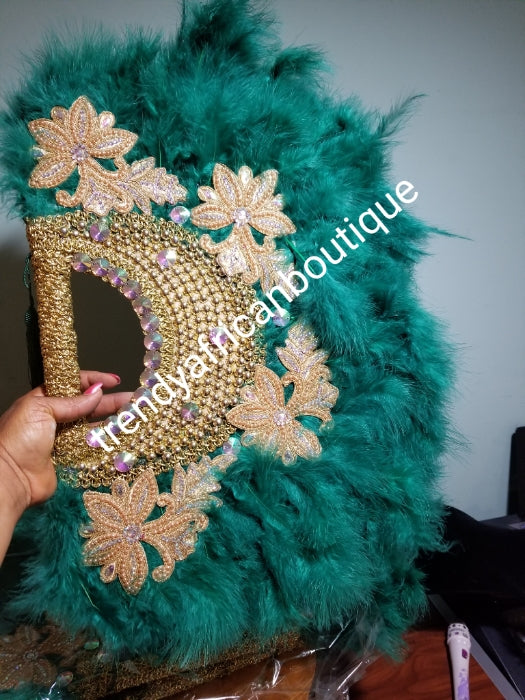 Large Teal Green color, Nigerian  made fluffy Feather hand fan. Hand made same front and back design with gold handle and 2 drop tassels  Bridal-accessories design with beads and flower petal.