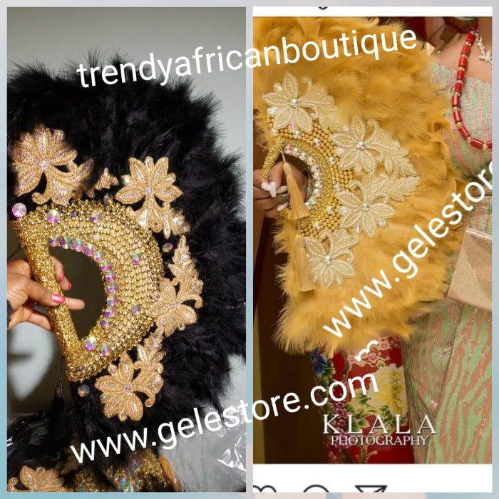Large Black/gold color, Nigerian  made fluffy Feather hand fan. Hand made same front and back design with gold handle, 2 drop tassels and gold petals and beads  Bridal-accessories design with beads and flower petal. Model shown is gold color