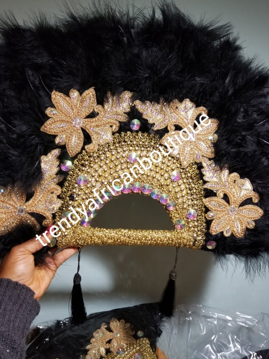 Large Black/gold color, Nigerian  made fluffy Feather hand fan. Hand made same front and back design with gold handle, 2 drop tassels and gold petals and beads  Bridal-accessories design with beads and flower petal. Model shown is gold color