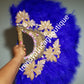 Large Royal blue/gold color, Nigerian  made fluffy Feather hand fan. Hand made same front and back design with gold handle, 2 drop tassels and gold petals and beads  Bridal-accessories design with beads and flower petal.