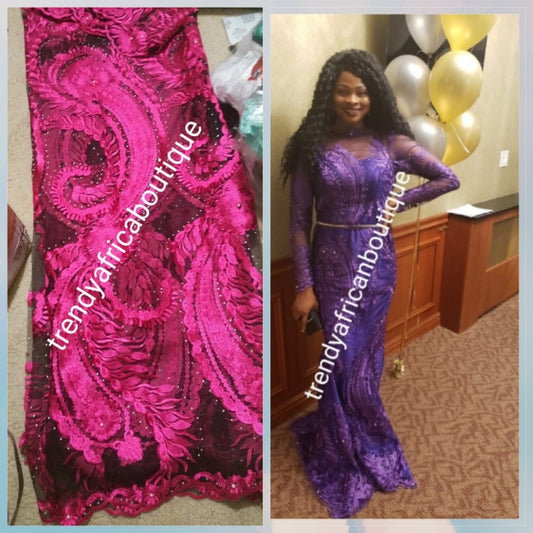 Black/fuchsia net french lace fabric with all over stones. Great quality. Sold per 5yrds. Model shown wearing Purple color