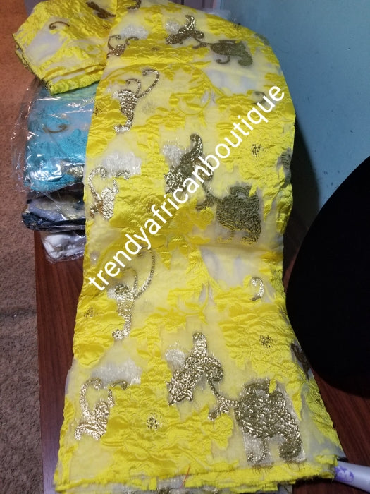 Beautiful yellow organza  french lace fabric/gold lurex.  latest design. Sold per 5yds. Nigerian/African french lace for making party outfit. Soft texture, luxurious design