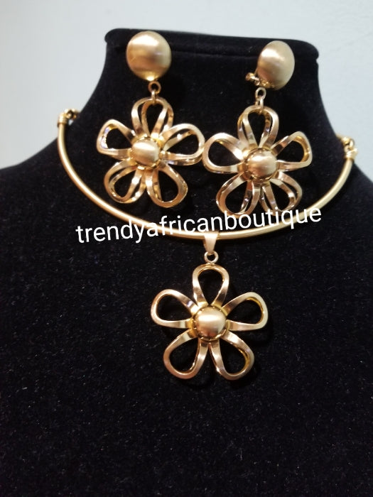 High quality 18k Gold plated 3pc pendant  set.  beautiful flower pendant with matching dangling  earrings. Sold with chain. Classic for casual wear.