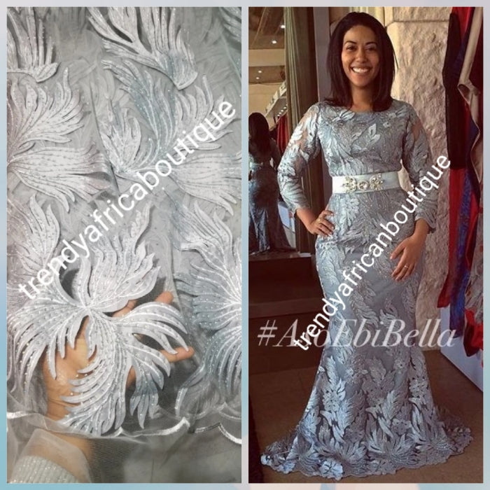 New arrival silver/Gray classic French lace design. Swiss quality embellished with crystal stoned. Sold per 5yds. Nigerian french lace fabric. Rich quality for wedding dress. For making Nigerian party dresses.