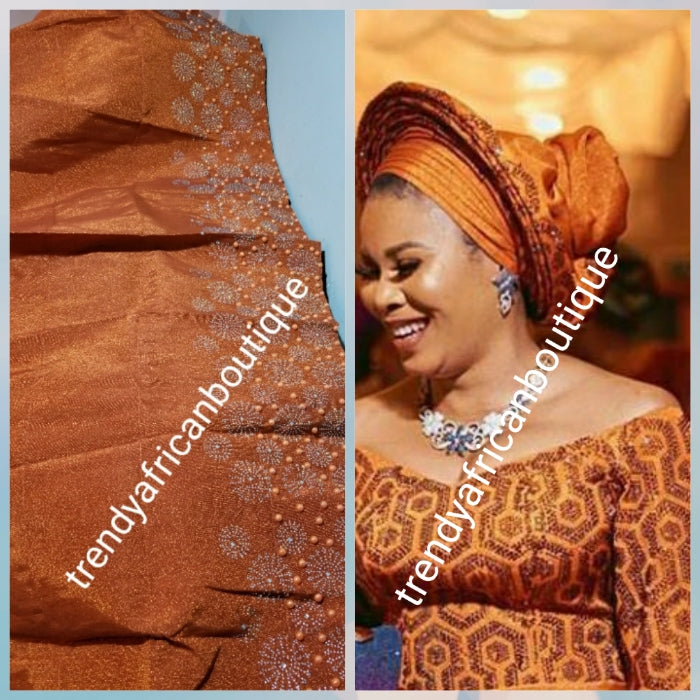 Classic Burnt Orange Bedazzled aso-oke. Nigerian woven traditional Aso-oke for making beautiful head wrap. Beaded and Swarovski stones work for perfect headwrap finish. Gele only. Extra wide gele for bigger head wrap. 72" long × 26" wide