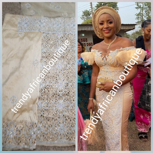 Beige  design  VIP hand cut embriodery Silk George wrapper and matching net blouse. Beige George, All Crystal stones to perfection. Quality Guaranteed. 2 wrapper of 2.5yds each and 1.8yds blouse. Nigerian madam George/Igbo Delta women wrapper
