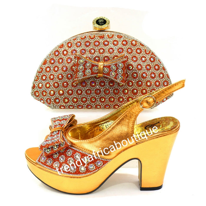 Europe size 39 Bronze/orange shoe and hand clutch set. Dazzling crystal stones. Platform heal with matching stylish hand clutch. Comfortable shoe and great balance. Light weight