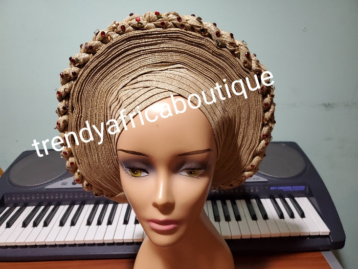 New arrival champagne gold auto-gele, classic design and  with wine color stones. made with Nigerian woven  aso-oke.  Party ready in less than 5 minutes. One size fit, easy adjustment at the back