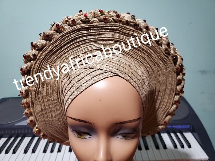 New arrival champagne gold auto-gele, classic design and  with wine color stones. made with Nigerian woven  aso-oke.  Party ready in less than 5 minutes. One size fit, easy adjustment at the back