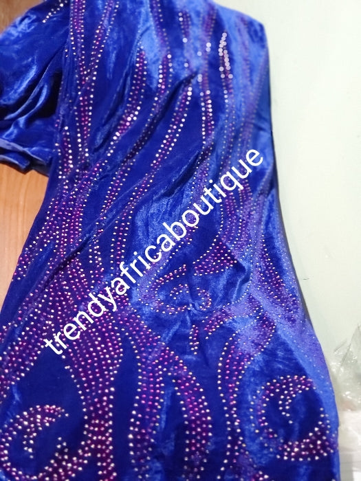 Royal blue VELVET wrapper embellished with colorful crystal stores. So soft with high quality for making Nigerian traditional wedding 1st outfit for. Sold per 5yds. Price is for 5yds.