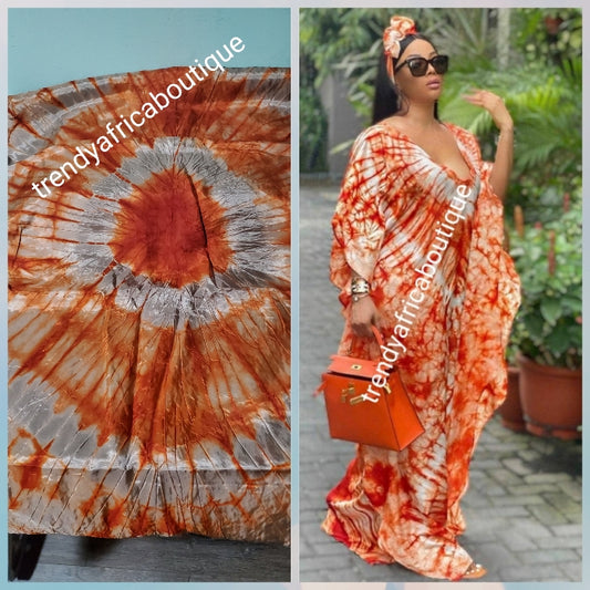 Adire silk fabric. Tie and dye or kampala sold as 4yards a piece. Orange/gray color. Grade A quality
