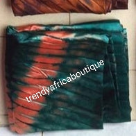 Adire silk fabric. Tie and dye or kampala sold as 4yards a piece. Green/orange color. Grade A quality