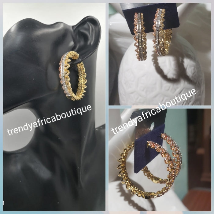 2 tone gold hoop earrings with clear crystal in 18k gold electroplating. Top quality made hypoallergenic. Light weight earrings.  Dubai gold earrings