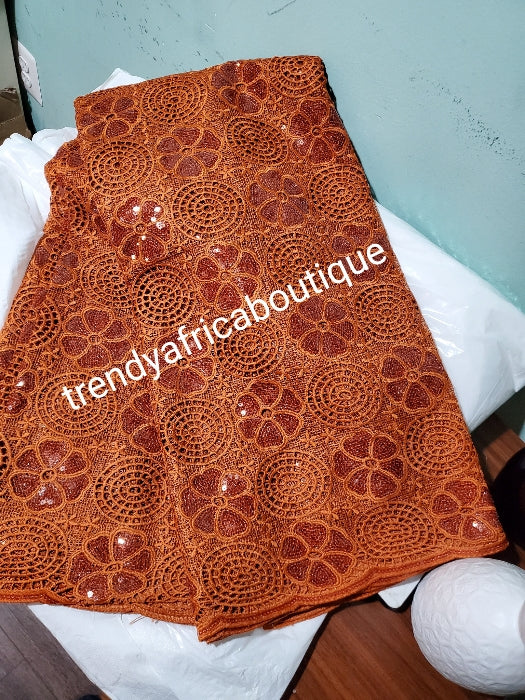 Sale: Burnt Orange Lustrous quality Africa french lace fabric embellished with sequence. Soft texture sold per 5 yards
