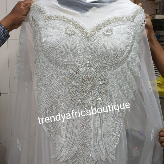 Pure white  Heavily-beaded/crystal stones net George for making blouses. Popularly use by Igbo/Delta/edo women for big Occasions. Comes in 1.8yds lenght already design for your beautiful celebrant blouse