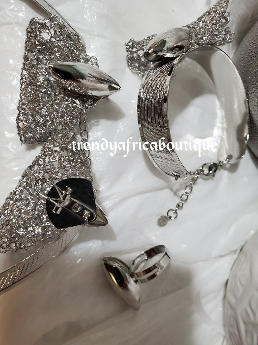 Elegant Silver set: Elegant Dubai 4pcs 18k electroplated choker necklace, matching earrings, bangle & adjustable ring. hypoallergenic plating. Sold as a set and price is for the set. As shown in display photo.