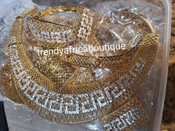 4pcs 2 tone omega set. 18k Quality Gold plated necklace with matching earrings, bangle, adjustable ring. hypoallergenic plating. Sold as a set and price is for the set. As shown in display photo.