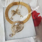 3pcs omega Gold electroplated top Quality pendant set. with matching earrings, bangle, adjustable hypoallergenic plating. Sold as a set and price is for the set. As shown in display photo.