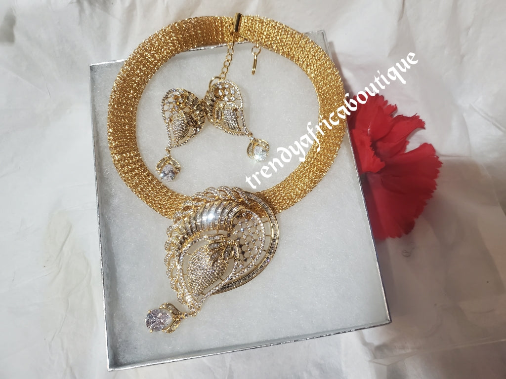 3pcs omega Gold electroplated top Quality pendant set. with matching earrings, bangle, adjustable hypoallergenic plating. Sold as a set and price is for the set. As shown in display photo.